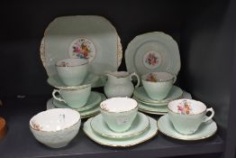 A 20th century Coalport part tea service with embossed and printed floral pattern