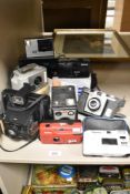 A selection of vintage photography cameras including Kodak, Halina, Polaroid, and Brownie