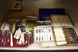 Seven cases of cutlery including fish knife and fork sets, butter knives, fish servers and cake