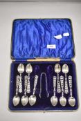 Four HM silver tea spoons having pierced handle decoration along with six similar and a pair of