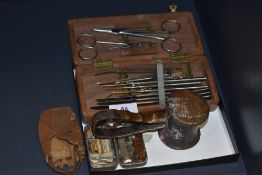 An early 20th century dissection kit along with an antique surgeons hammer and a WW1 issue field