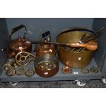 A selection of fire side items including large copper stove kettle, copper sauce pan, jam pan and