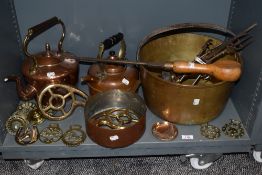 A selection of fire side items including large copper stove kettle, copper sauce pan, jam pan and