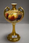 An early 20th century Royal Worcester mantel urn having purple back stamp, hand decorated with