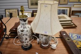 Two matching side or table lamps with a Chinese pattern design