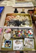 A collection of vintage ladies costume jewellery including earrings, necklaces and scent bottles