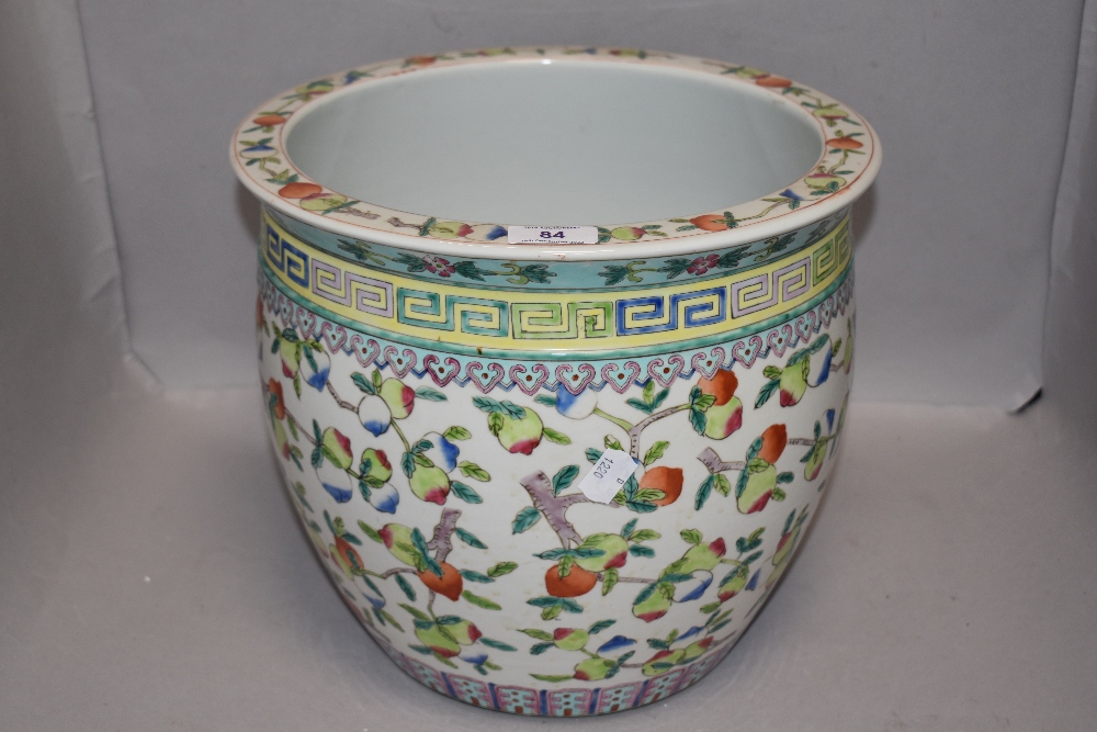 A Chinese porcelain planter decorated with fruit and Greek key boarder