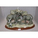 A modern Lenox figure group of elephants titled Thundering Plains