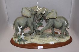 A modern Lenox figure group of elephants titled Thundering Plains