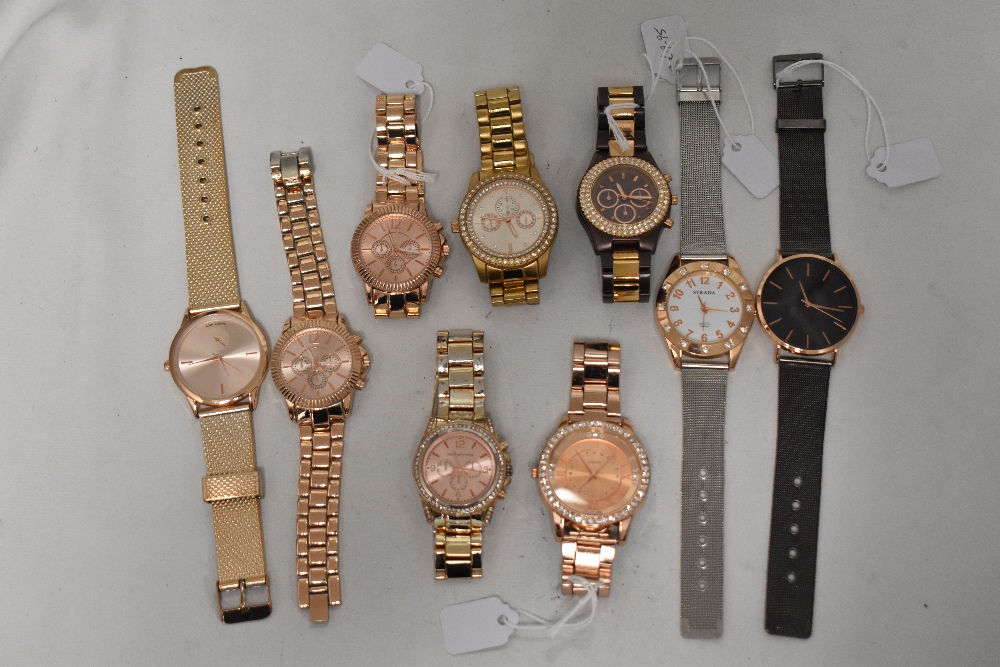 Nine mens watches including rose gold tones.