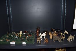 A good collection of early 20th century lead and metal cast dog and cat figure studies including a