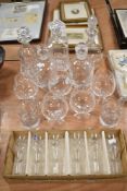 A collection of clear cut crystal glass wares including a cased set of Royal Doulton wine glasses,