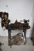 A vintage lathe and accessories