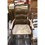A traditional rush seated ladder back chair