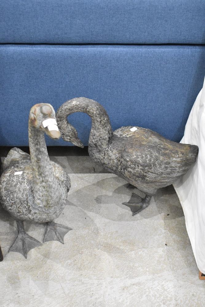 Two cast brass life size geese