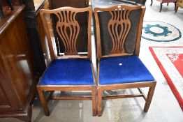 A pair of Georgian oak dining chairs having later blue dralon seats