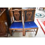 A pair of Georgian oak dining chairs having later blue dralon seats