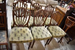 A set of six early 20th Century mahogany framed reproduction dining chairs in the Hepplewhite style