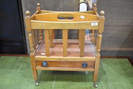 A reproduction Canterbury style magazine rack