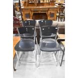 A set of four chrome and plastic kitchen bar stools