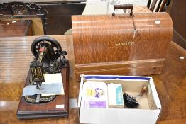 Two vintage sewing machines and accessories