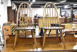 A pair of Ercol high hoop and stick back dining chairs