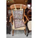 A traditional stained frame Windsor style spindle back carver chair having turned frame and H