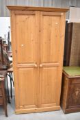 A modern pine wardrobe, approx H194 W96 D60cm