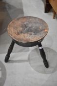 A traditional pokerwork stool carved 'TOUCH ME WHA DAUR' The circular top with thistle flower and