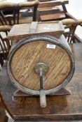 An antique wooden butter churn/tombola