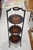 An early 20th Century mahogany cake stand