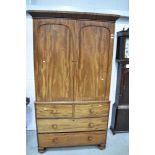 A 19th Century mahogany linen press having two over two drawer base