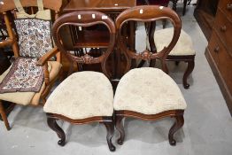 A set of three Victorian mahogany balloon back dining chairs