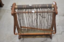 A traditional weaving loom of small proportions