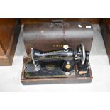 A vintage dome cased Singer sewing machine