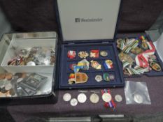 A box and a case of Coins and Medals, Coins include a 1927 Silver Half Crown, 1922 and 1923 Silver