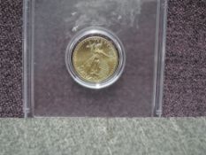 A US 2011 5 Dollar Coin, 1/10oz Fine Gold in plastic capsule