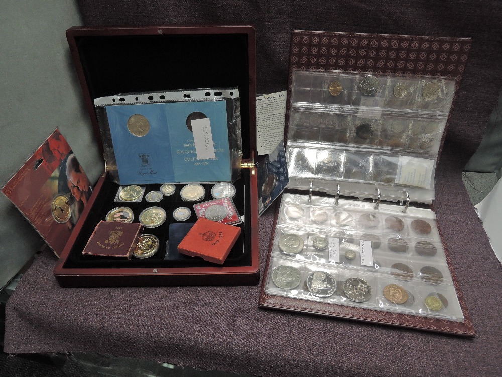 A collection of mainly GB Coins in albums and wood case including Roman Coin, Charles I Farthing,