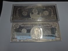 A US Silver 100 Dollar Bill, President Franklin United States of American in plastic case and a US