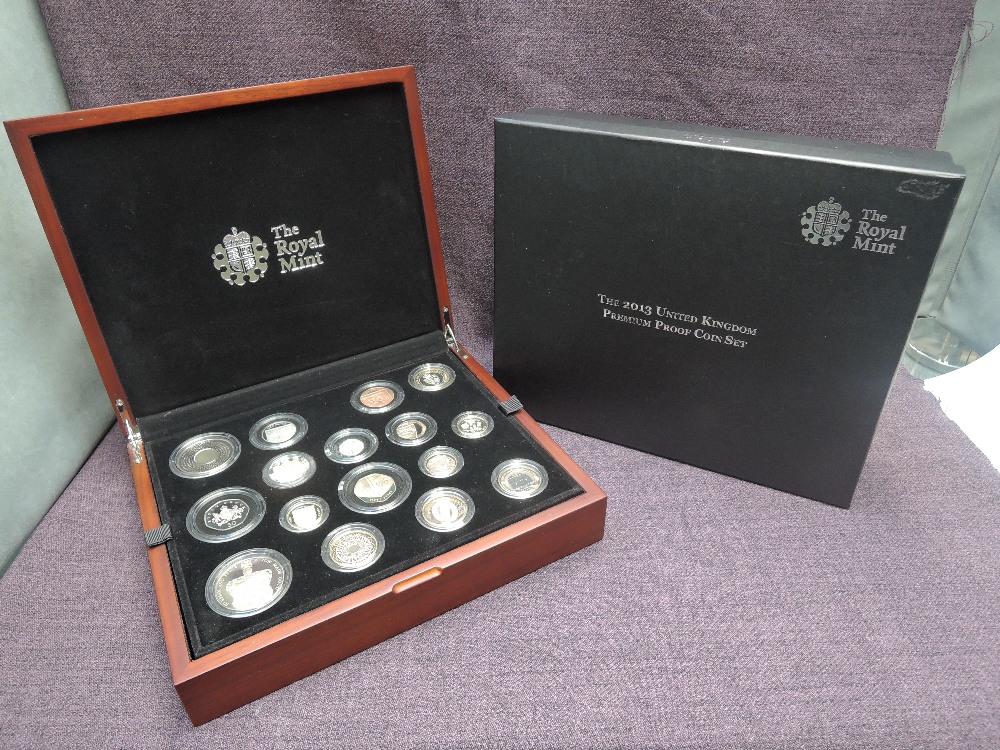 A Royal Mint United Kingdom 2013 Premium Proof Coin Set, 16 coins with certificate in wooden