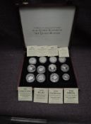 A collection of 11 Silver World Crown Sized Coins along with one small Silver Coin, eight with