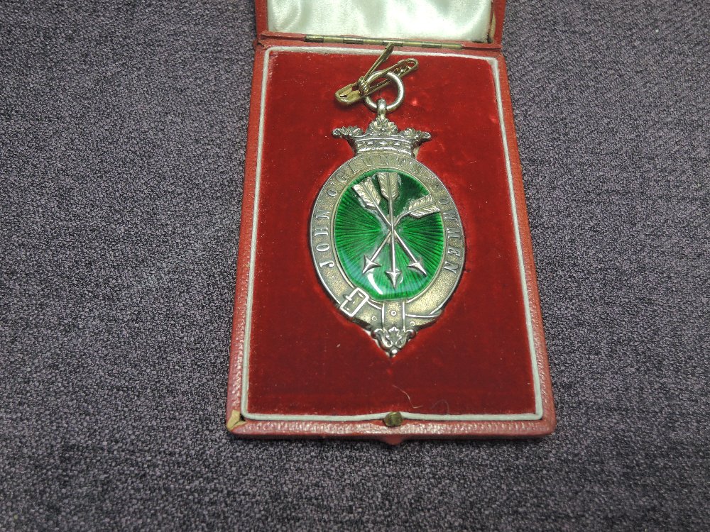 A white metal John O'Gaunt Bowmen Medallion in fitted case retailed by Martin & Co Cheltenham