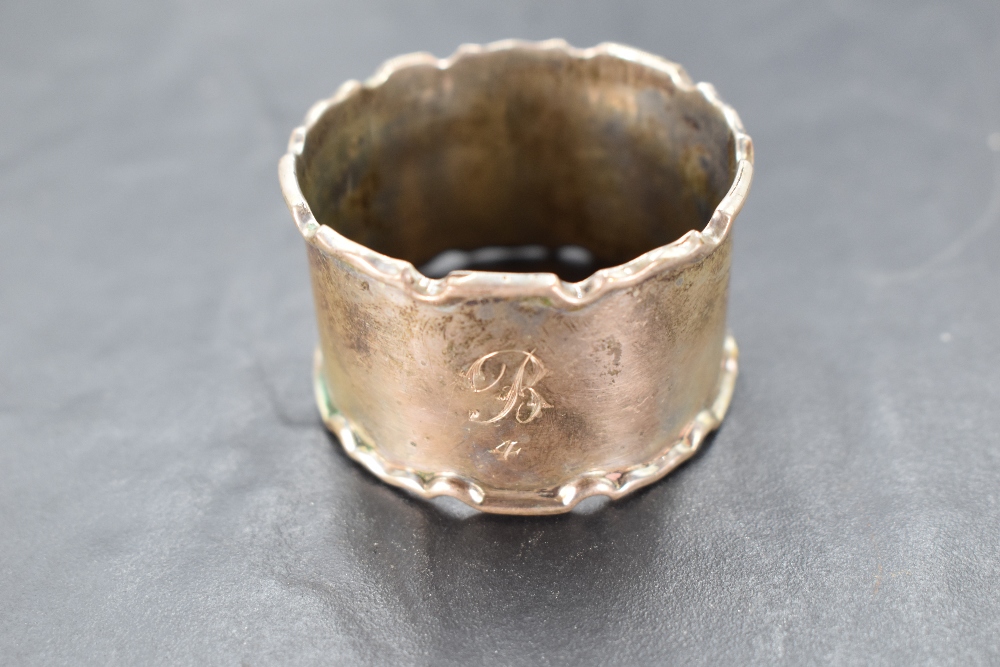 A cased set of six George V silver napkin rings, of circular form with moulded edge detail, engraved - Image 2 of 3