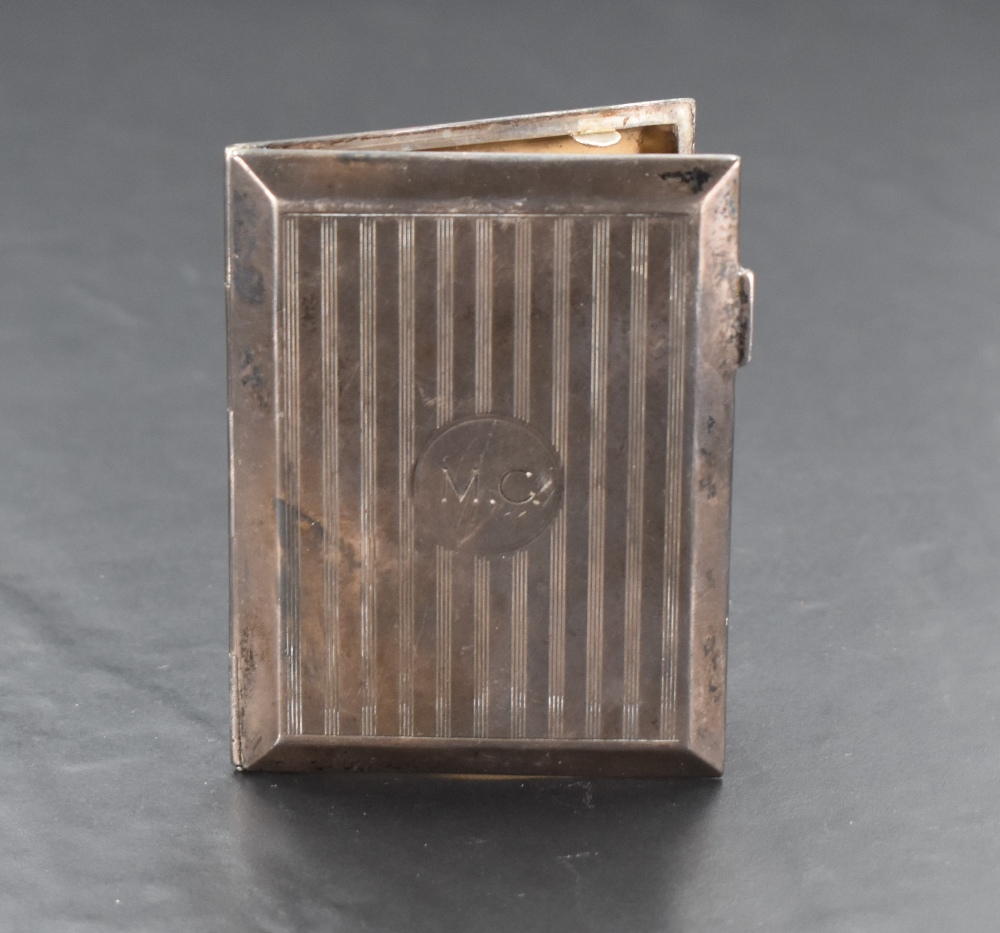 A George V silver visiting card case, of hinged rectangular form, with engine-turned decoration