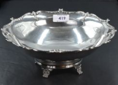 A silver table bowl of plain form having moulded decoration to shaped rim and bracket feet,