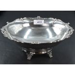 A silver table bowl of plain form having moulded decoration to shaped rim and bracket feet,