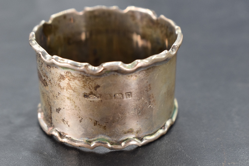 A cased set of six George V silver napkin rings, of circular form with moulded edge detail, engraved - Image 3 of 3