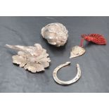 Four HM silver and white metal trinkets including lucky horseshoe, pheasant study, conche shell