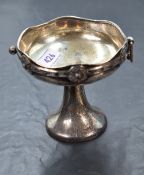 A George V silver pedestal dish, of Arts and Crafts design with repeating Celtic knot decoration,