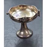 A George V silver pedestal dish, of Arts and Crafts design with repeating Celtic knot decoration,